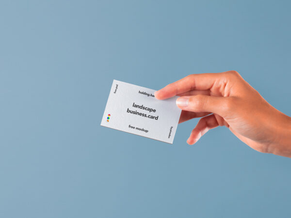 Hand holding horizontal Business Card Mockup