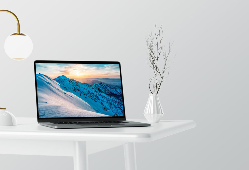 MacBook Pro on white Table Mockup