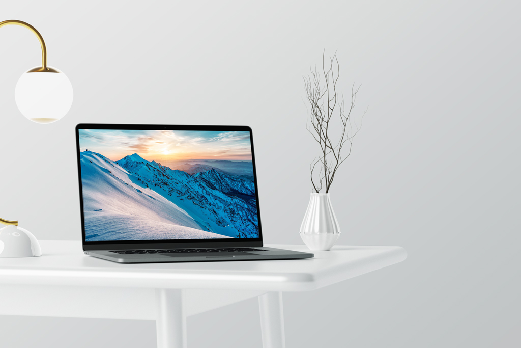 MacBook Pro on white Table Mockup
